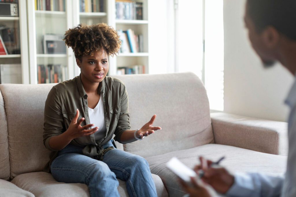 a woman speaking to therapist